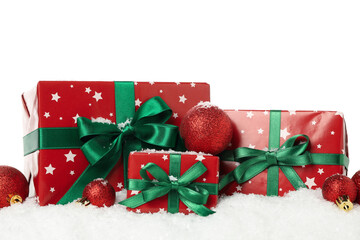 Gift boxes, baubles and snow isolated on white background