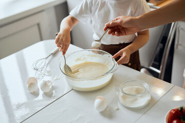 White bowl with dough for pancakes.