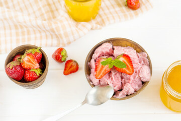 strawberry ice cream on a white table