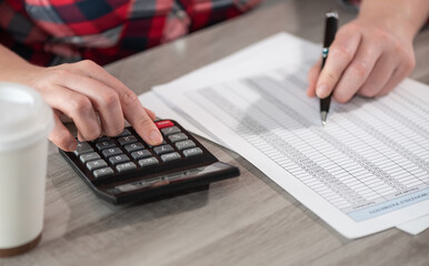 Woman using calculator