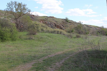 Clay mining. Waste soil hill and quarry road.