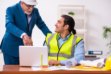 Two male architects working in the office