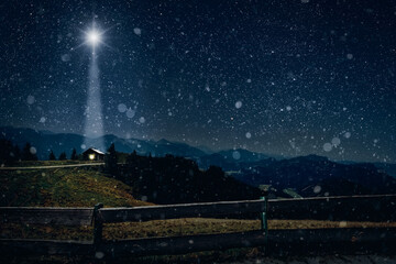 The star shines over the manger of christmas of Jesus Christ.