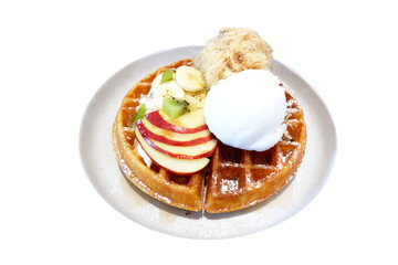 Freshly baked Waffles with ice cream, kiwi and apple for breakfast, dessert, isolated on white background.