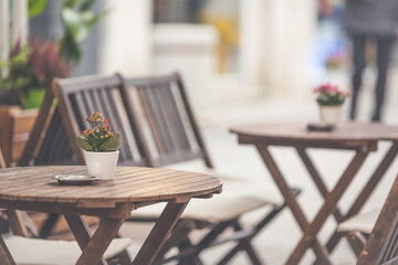 Outdoor street restaurant with tables and chairs