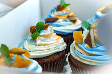 Tricolor cream cupcakes in a white package