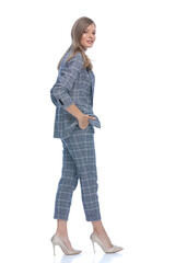 side view of confident businesswoman holding hands in pockets