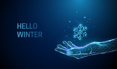 Abstract low poly giving hand with falling snowflake