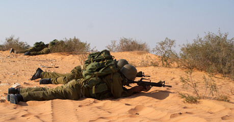 Israeli soldiers excersice in a desert