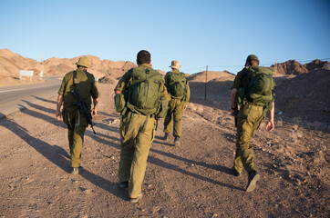 Fototapeta premium Soldiers patrol in desert
