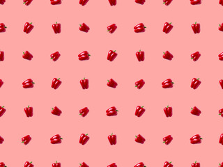 sweet bell pepper pattern. vegetables on a pastel pink background.