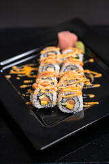 Japanese salmon mayo roll on black background