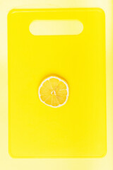 Lemon slices on a yellow Board close up
