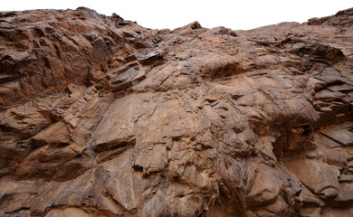 A rugged rock face in the Gamkab valley of southern Namibia against a cloudy sky