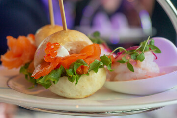 mini salmon canapes burger on tray