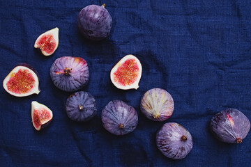 Ripe sweet figs of blue color, dark toned photo.
