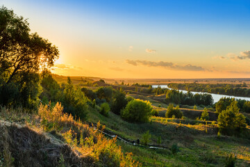 Fototapeta na wymiar Sunset on the Oka river in the village Konstantinovo - Russia