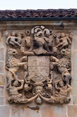 Shield carved in stone with the arms of Miera, Rubalcaba, Velasco, Riba and Agüero. Facade of Miera-Rubalcaba in the town of Rubalcaba, Liérganes, Valles Pasiegos, Cantabria, Spain