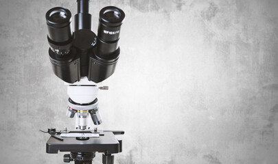 Using a biological microscope. Close up of a microscope. Scientific research concept, using a...