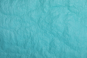 Crumpled green sheet of paper. Texture.