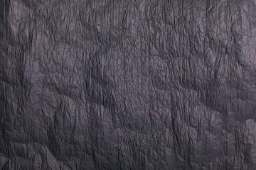 Gray crumpled paper texture or background
