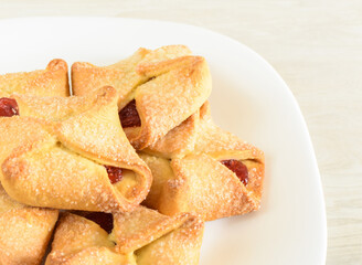 Homemade cookies with jam on a white plate. Selective focus, blurred background.