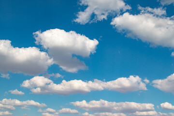 Obraz na płótnie Canvas white clouds on blue background