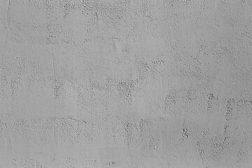 Gray concrete wall with plaster and stone texture. Gray wall background. Copy space