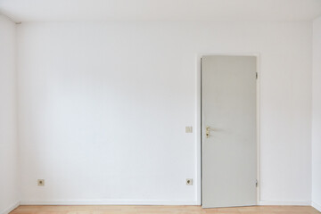 Door in wall in empty room as a bedroom or office