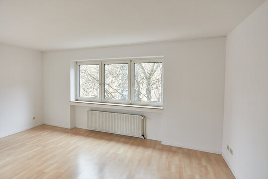 Large empty room as living room in apartment after renovation