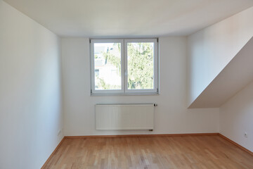 Fototapeta premium Empty interior room in the attic with wood parquet