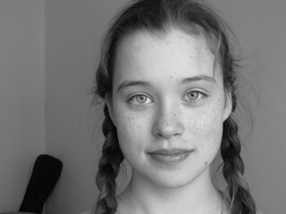 Portrait of a girl with two braids