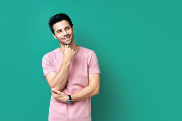 Handsome smiling young man on blue background