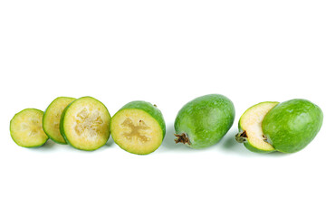 Whole and sliced feijoa fruits isolated on white background