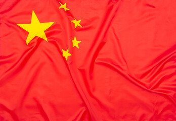 Real natural fabric flag of China or National Flag of the People's Republic of China as texture or background 
