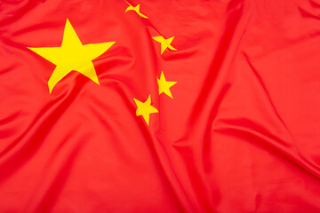 Real natural fabric flag of China or National Flag of the People's Republic of China as texture or background 