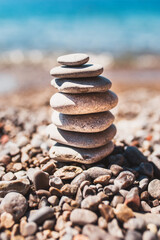 Fototapeta na wymiar Stack of stones on the beach - relaxation and recovery - balance of mind and body