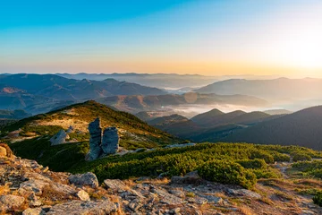 Amazing sunrise high in the mountains. Autumn morning at the mountain top. © Mny-Jhee