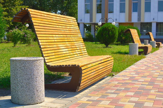 Wooden high backed bench in the park