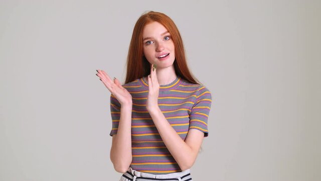 Young Displeased Sarcastic Redhead Woman Isolated Over White Wall Background Giving Applause To You