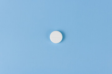 white pill on blue background