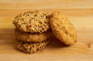 Four cookies with cereals and sesame seeds