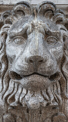 Fototapeta na wymiar Ancient decoration element of scary lion head at roof of Basilica San Marco and Doge Palace in Venice, Italy