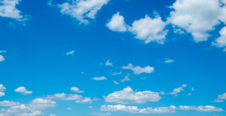 Naklejka na ściany i meble White clouds in blue sky.