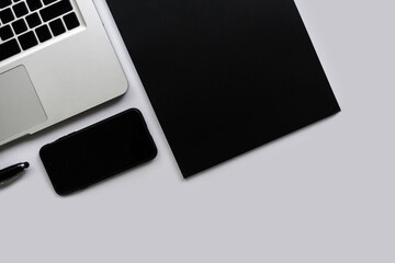 Top view office desk with work supplies and computer.