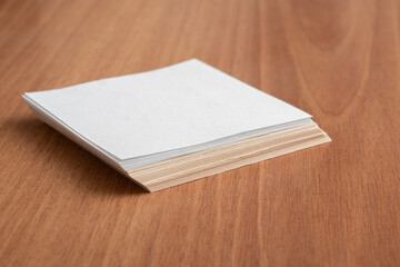 Workspace with blank paper on wooden table, selective focus, copy space, top view. Business, school concept