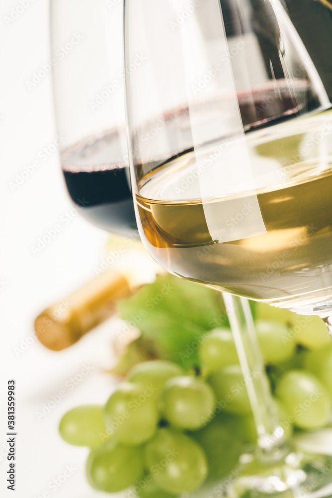 Sticker Glasses of white, red and rose wine and grapes