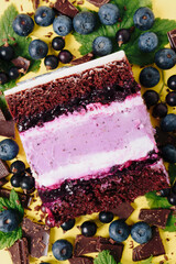 Slice of cake in the section on the background of fruit