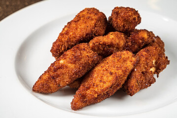 chicken nuggets on the white plate
