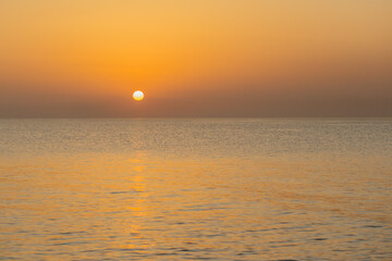 Full sun sunset over the sea. Amazing marine sunset.
